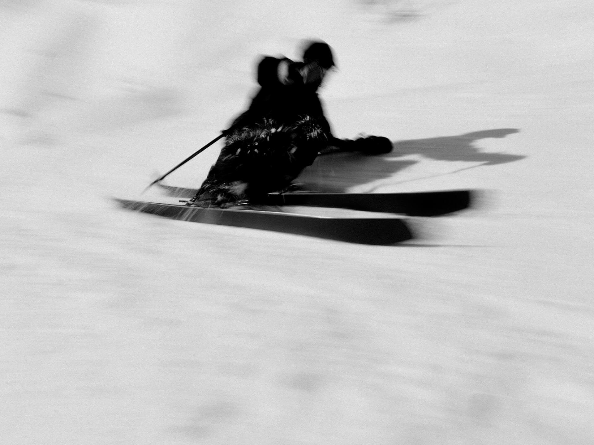 Laurent De Martin in fast blurred motion on slope riding the Simply. Recreation. 180